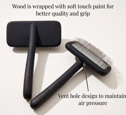 Two black pet grooming brushes on a light beige background with explanatory text overlays highlighting the wood wrap, grip, and vent hole design.