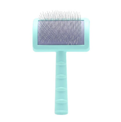 A pet grooming brush with a light mint green handle and head, featuring silver metal bristles on a purple-tinted pad, isolated on a white background.